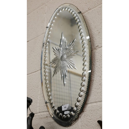 64 - A sorcerer's mirror 61 cm x 30 cm to/w a small mirror back sconce (no sconce arm) 18 cm x 13 cm, bot... 