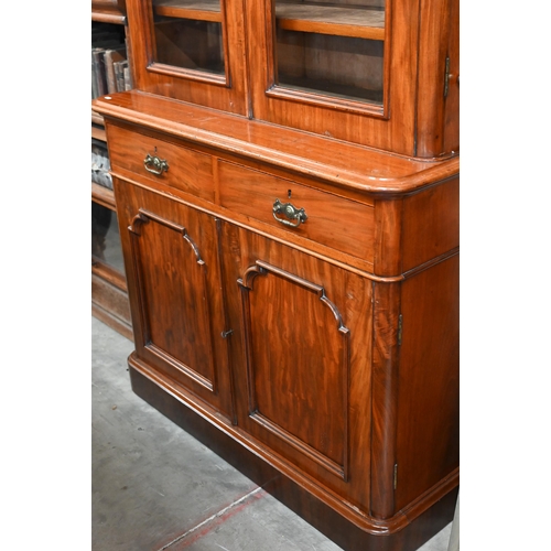 66 - A Victorian mahogany chiffonier bookcase with glazed doors over drawers and panelled cupboards, 110 ... 