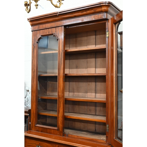 66 - A Victorian mahogany chiffonier bookcase with glazed doors over drawers and panelled cupboards, 110 ... 