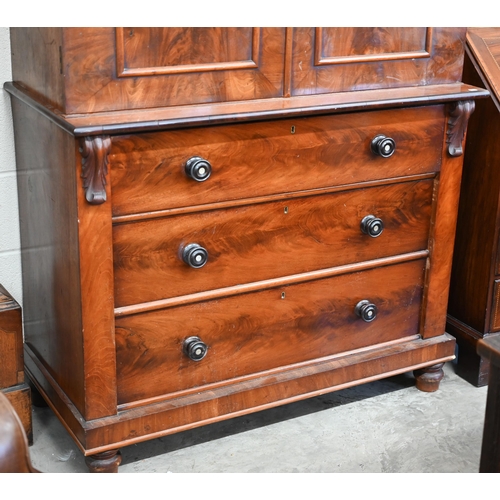 68 - A 19th century mahogany linen press (slides removed and replaced with two brass rails), with arch pa... 