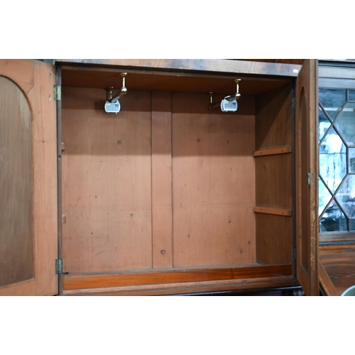 68 - A 19th century mahogany linen press (slides removed and replaced with two brass rails), with arch pa... 