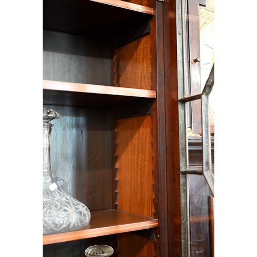 69 - A 19th century mahogany inlaid bureau bookcase with astragal glazed doors over fall-front panel with... 