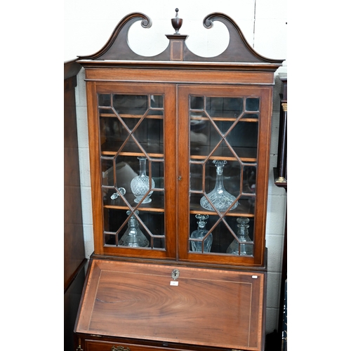 69 - A 19th century mahogany inlaid bureau bookcase with astragal glazed doors over fall-front panel with... 