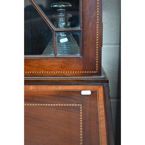 69 - A 19th century mahogany inlaid bureau bookcase with astragal glazed doors over fall-front panel with... 