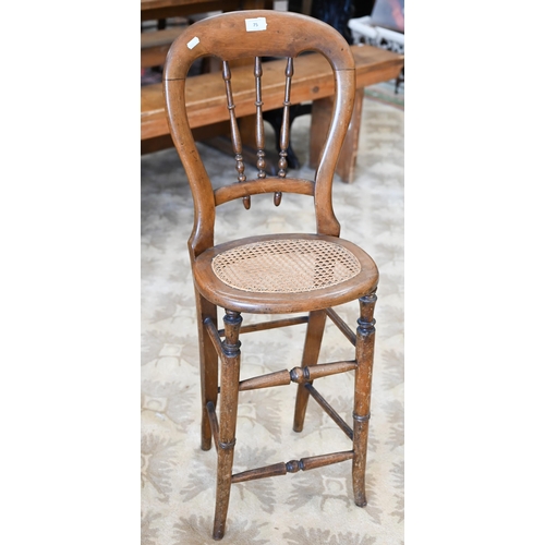 75 - A Victorian spindle back correction chair with caned seat