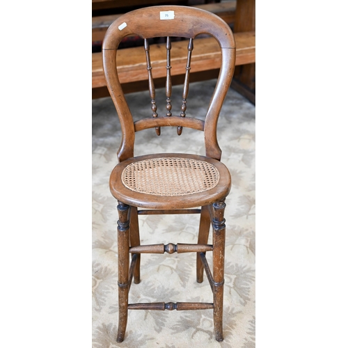 75 - A Victorian spindle back correction chair with caned seat