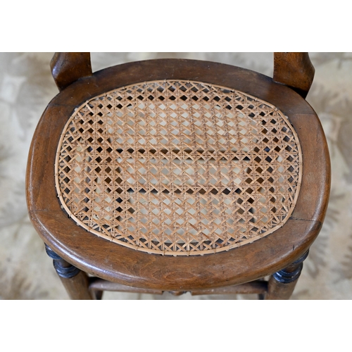 75 - A Victorian spindle back correction chair with caned seat