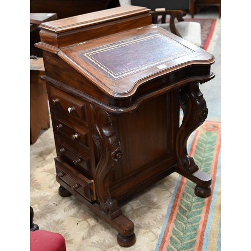 76 - A walnut Davenport with gilt tooled leather top and four drawers to each side, 56 x 54 x 85 cm high