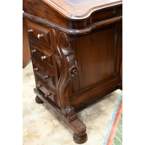 76 - A walnut Davenport with gilt tooled leather top and four drawers to each side, 56 x 54 x 85 cm high