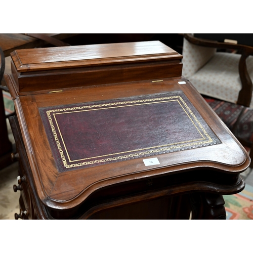 76 - A walnut Davenport with gilt tooled leather top and four drawers to each side, 56 x 54 x 85 cm high