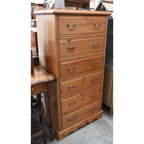 77 - A stained pine six drawer tallboy chest, 68 x 44 x 145 cm high