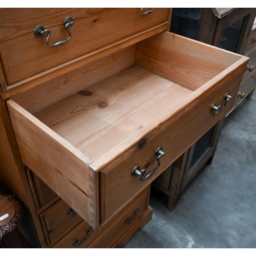 77 - A stained pine six drawer tallboy chest, 68 x 44 x 145 cm high