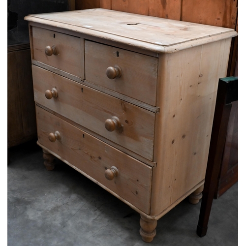 79 - A small pine chest of two short over two long drawers raised on turned supports, 86 x 48 x 84 cm hig... 