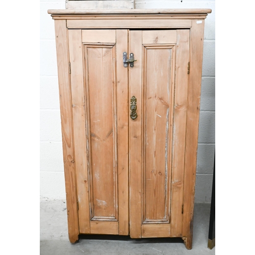 81 - A pine two-door side cabinet with shelved interior, 74 x 50 x 130 cm high