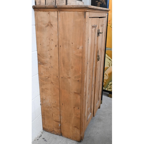 81 - A pine two-door side cabinet with shelved interior, 74 x 50 x 130 cm high