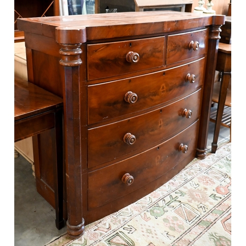 87 - A 19th century mahogany bowfront chest of two short over three long drawers between octagonal pillar... 