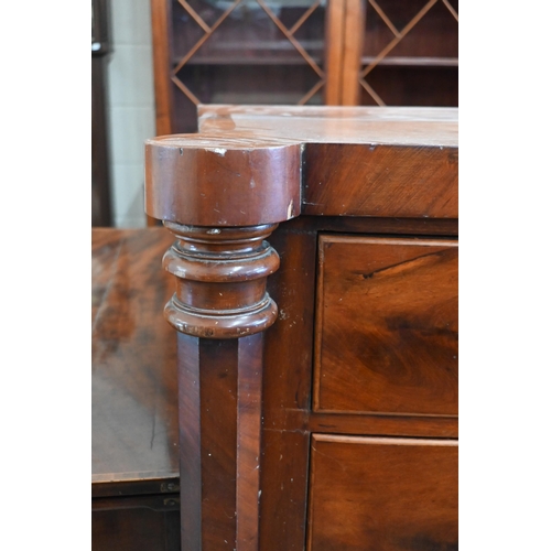 87 - A 19th century mahogany bowfront chest of two short over three long drawers between octagonal pillar... 