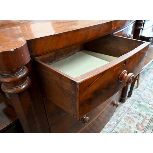 87 - A 19th century mahogany bowfront chest of two short over three long drawers between octagonal pillar... 