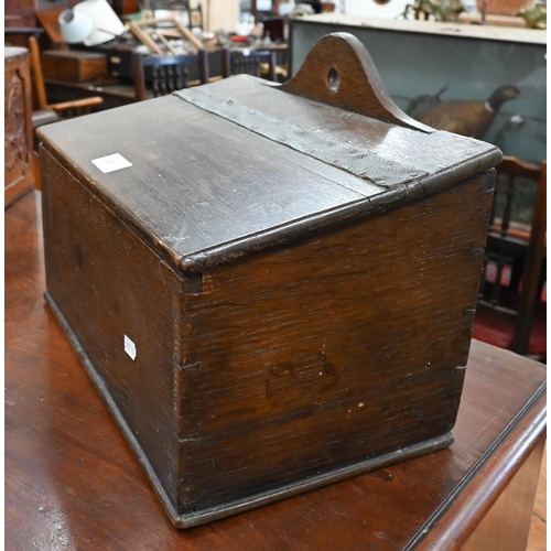 91 - An antique oak slopetop candle box, 38 x 22 x 28 cm high to/w an antique wooden pipe-rack carved wit... 