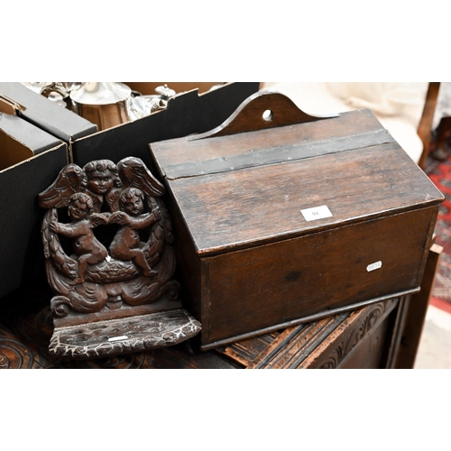 91 - An antique oak slopetop candle box, 38 x 22 x 28 cm high to/w an antique wooden pipe-rack carved wit... 