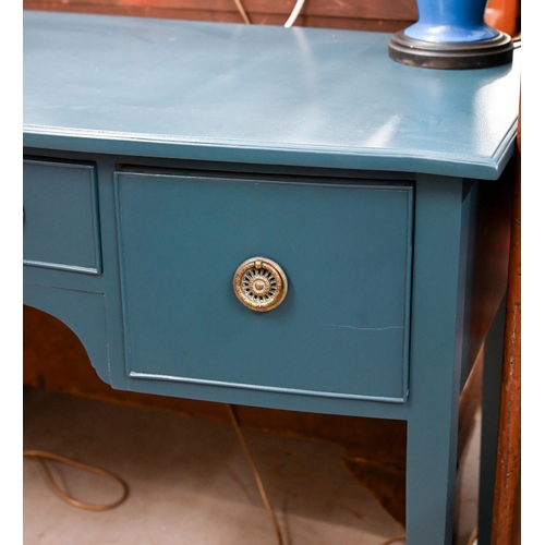 92 - A blue painted three drawer sideboard with brass handles and tapering square supports, 122 x 54 x 84... 