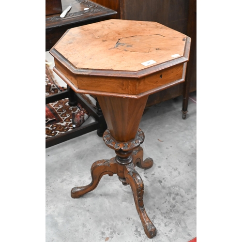 93 - A Victorian octagonal walnut sewing table with carved tripod base, 42 cm diam x 70 cm high