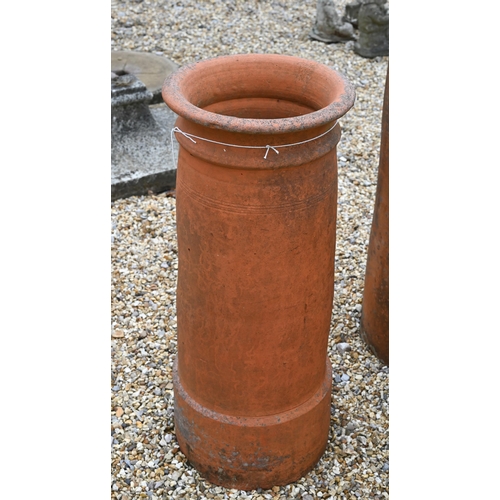 14 - A trio of tall cylindrical reclaimed and weathered terracotta chimney pots, 92 cm; 82 cm and 71 cm h... 