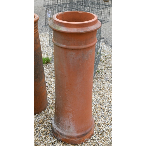 14 - A trio of tall cylindrical reclaimed and weathered terracotta chimney pots, 92 cm; 82 cm and 71 cm h... 