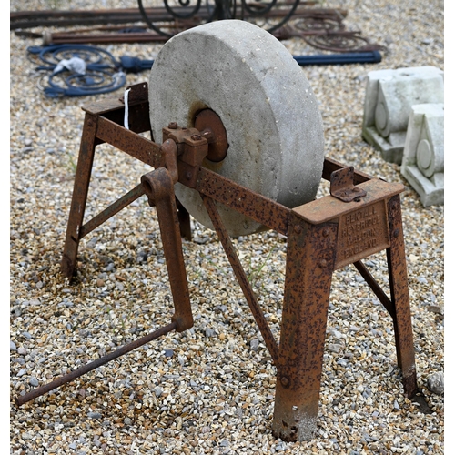 18 - # A weathered vintage iron framed grindstone by Bentalls, with crank handle