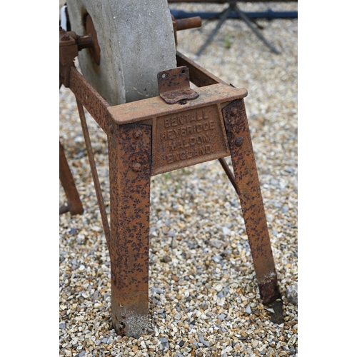 18 - # A weathered vintage iron framed grindstone by Bentalls, with crank handle