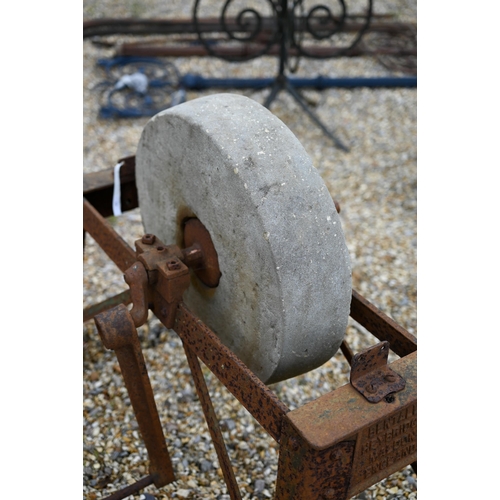 18 - # A weathered vintage iron framed grindstone by Bentalls, with crank handle