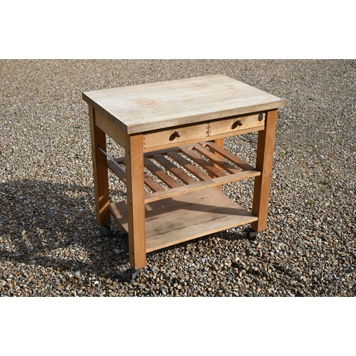 347 - A traditional beech kitchen island trolley unit, with two frieze drawers over two wicker baskets and... 