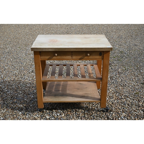 347 - A traditional beech kitchen island trolley unit, with two frieze drawers over two wicker baskets and... 