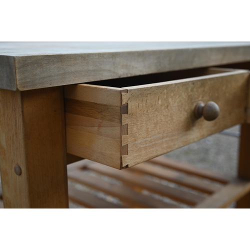 347 - A traditional beech kitchen island trolley unit, with two frieze drawers over two wicker baskets and... 