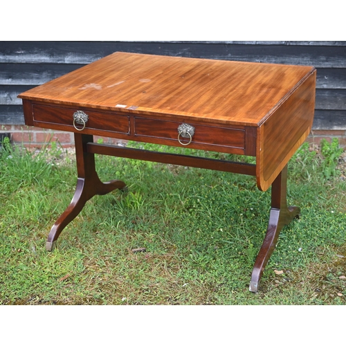 348 - A Victorian mahogany drop end sofa table, with two frieze drawers and raised on trestle ends united ... 