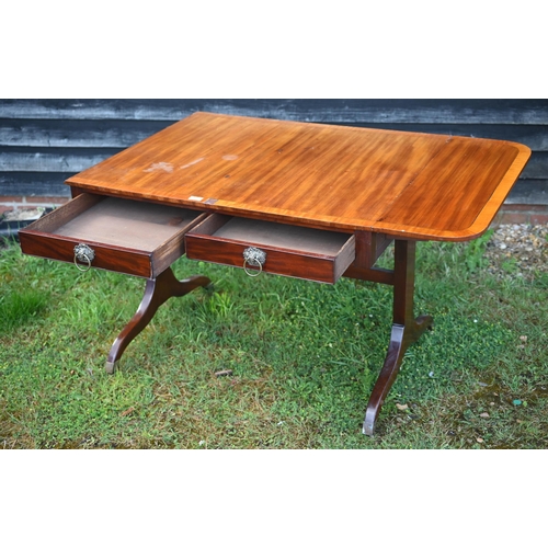 348 - A Victorian mahogany drop end sofa table, with two frieze drawers and raised on trestle ends united ... 