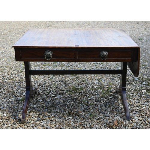 348 - A Victorian mahogany drop end sofa table, with two frieze drawers and raised on trestle ends united ... 