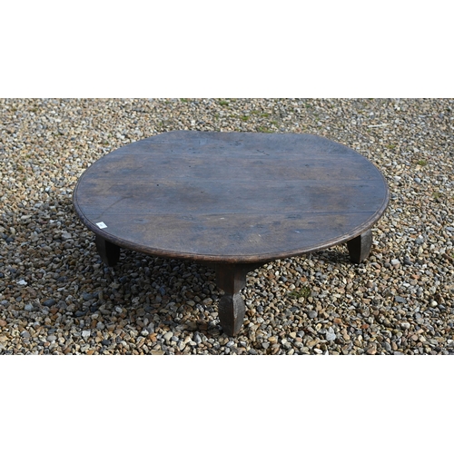 349 - An antique low circular hardwood coffee table, on four square legs, 102 cm dia. x 32 cm h, top part ... 