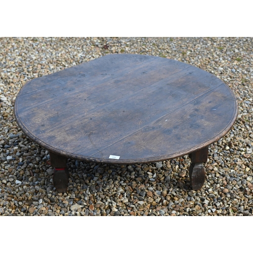 349 - An antique low circular hardwood coffee table, on four square legs, 102 cm dia. x 32 cm h, top part ... 