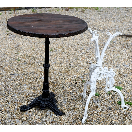 41 - A traditional circular wooden top table to/with a Victorian style cast iron tripod table base, both ... 