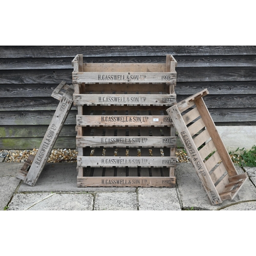 42 - H Casswell & Son Ltd, a stack of eight vintage branded wooden fruit crates, 75 cm x 45 cm x 16 c... 