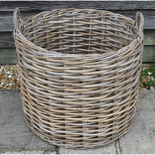 45 - A 'giant' wicker log basket with twin loop handles, 63 cm dia. x 51 cm h, new old-stock