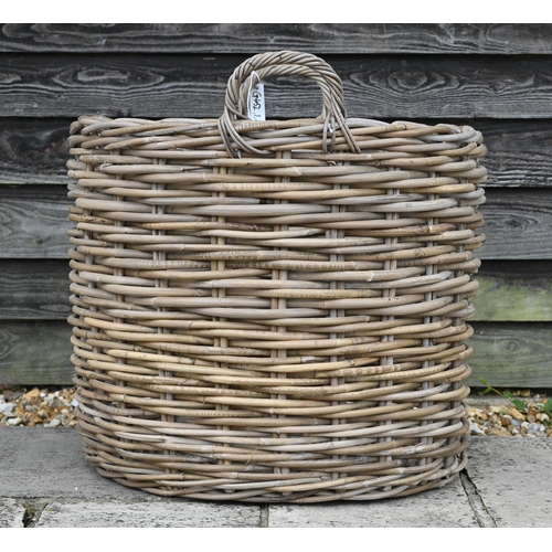 45 - A 'giant' wicker log basket with twin loop handles, 63 cm dia. x 51 cm h, new old-stock