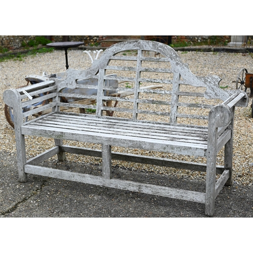 5 - A weathered teak Lutyens design garden bench, 150 cm long, a/f