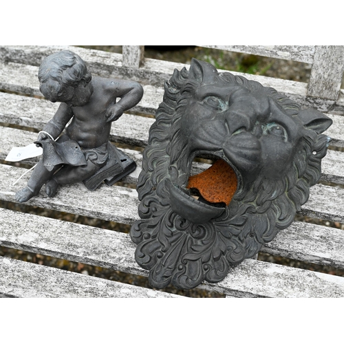 50 - A classic lead seated putti with scroll to/w a bronzed lion wall mask with hinged mouth, both a/f (2... 