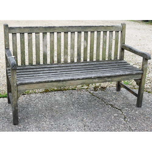 8 - A weathered teak slatted garden bench, 150 cm long