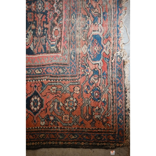 116 - A worn Persian Hamadan kelleigh carpet, Herati design on navy blue ground with terracotta border, 40... 