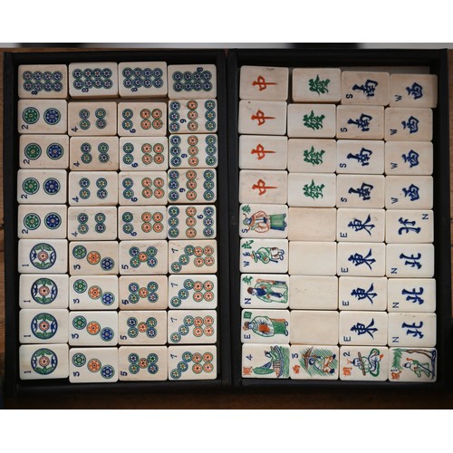 451 - An antique Chinese Mah Jong set with bone and bamboo tiles, in rosewood case with five drawers