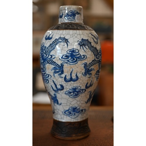 406 - A Chinese blue and white vase painted with dragons on a crackle glaze with incised biscuit bands,27 ... 