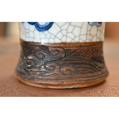 406 - A Chinese blue and white vase painted with dragons on a crackle glaze with incised biscuit bands,27 ... 